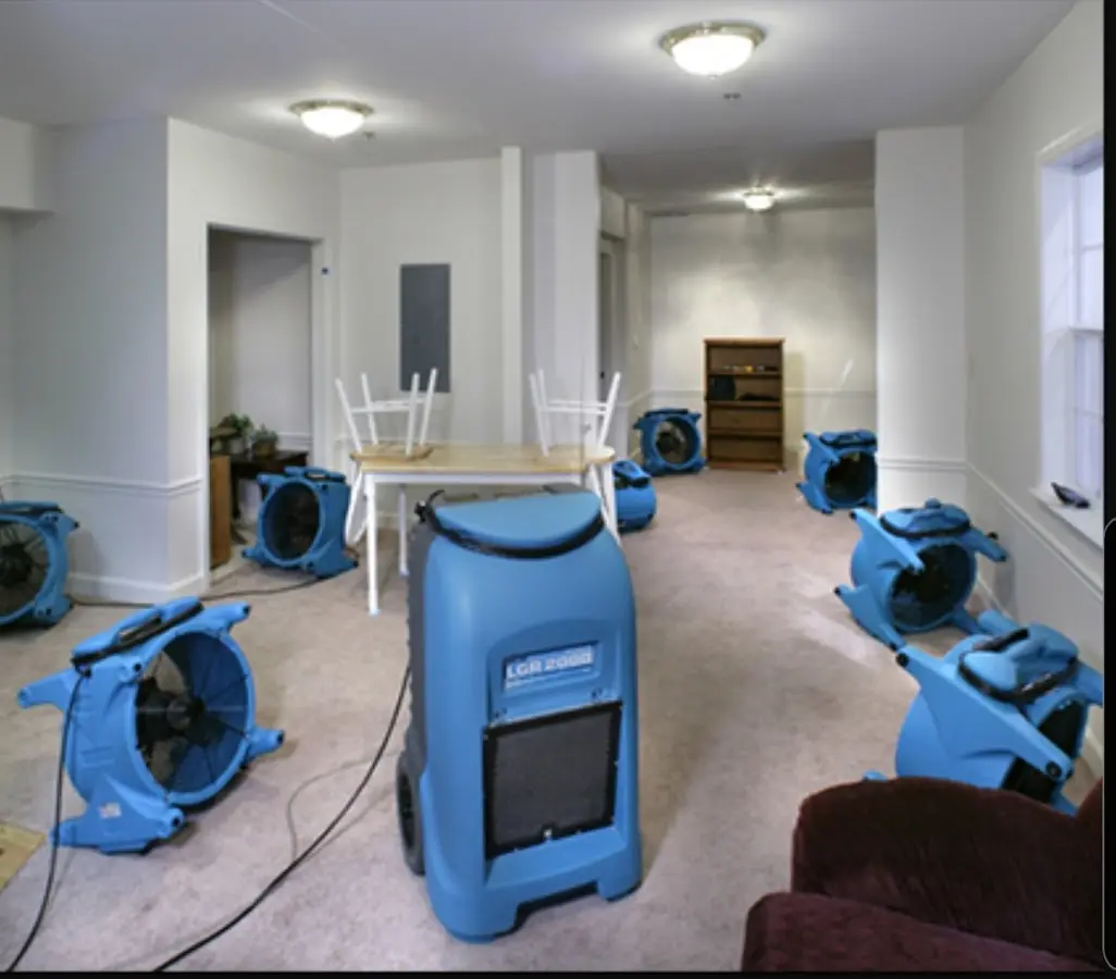 Air movers and dehumidifier setup for Water Damage Restoration in Peru